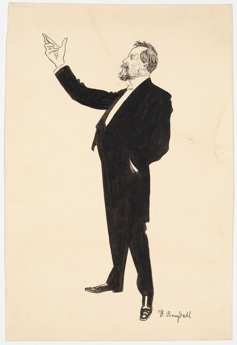 En man iklädd frack med skägg. Han håller höger hand utsträck och sin vänstra han i byxfickan.
