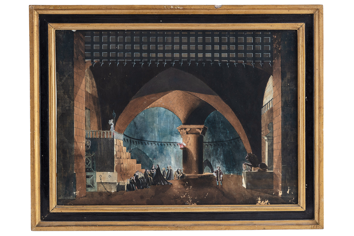 akt 1 scen 1, "i en valv under Stockholms slott", en mörkt gotisk valv, scenen öppnar sig genom tungt murverk att båda sidor och på övre delen en uppdragen gallergrind. På vänstra sida leder en trappa ner in i valven som är vänd ifran publiken, på övre trappavsats stå en vaktsoldat. Nere vid trappans sida sitter och stå förnäma kvinnor och barn. Mitt på scenen är en tjock rund kolonn som verka stöda hela arkitekturen, vid dess bas är ochså förnäm folk som stå och sitter, hela scenen är uppljyst med en enda eld som är i en skål hängande från den tjocka kolonn. På högra sida stå en ensam man i wasatidenskostym och långst till höger är en lejonskulptur i profil som håller en vapenskjold och stå på en katafalk, bakgrunden är en blå källarevalv.
