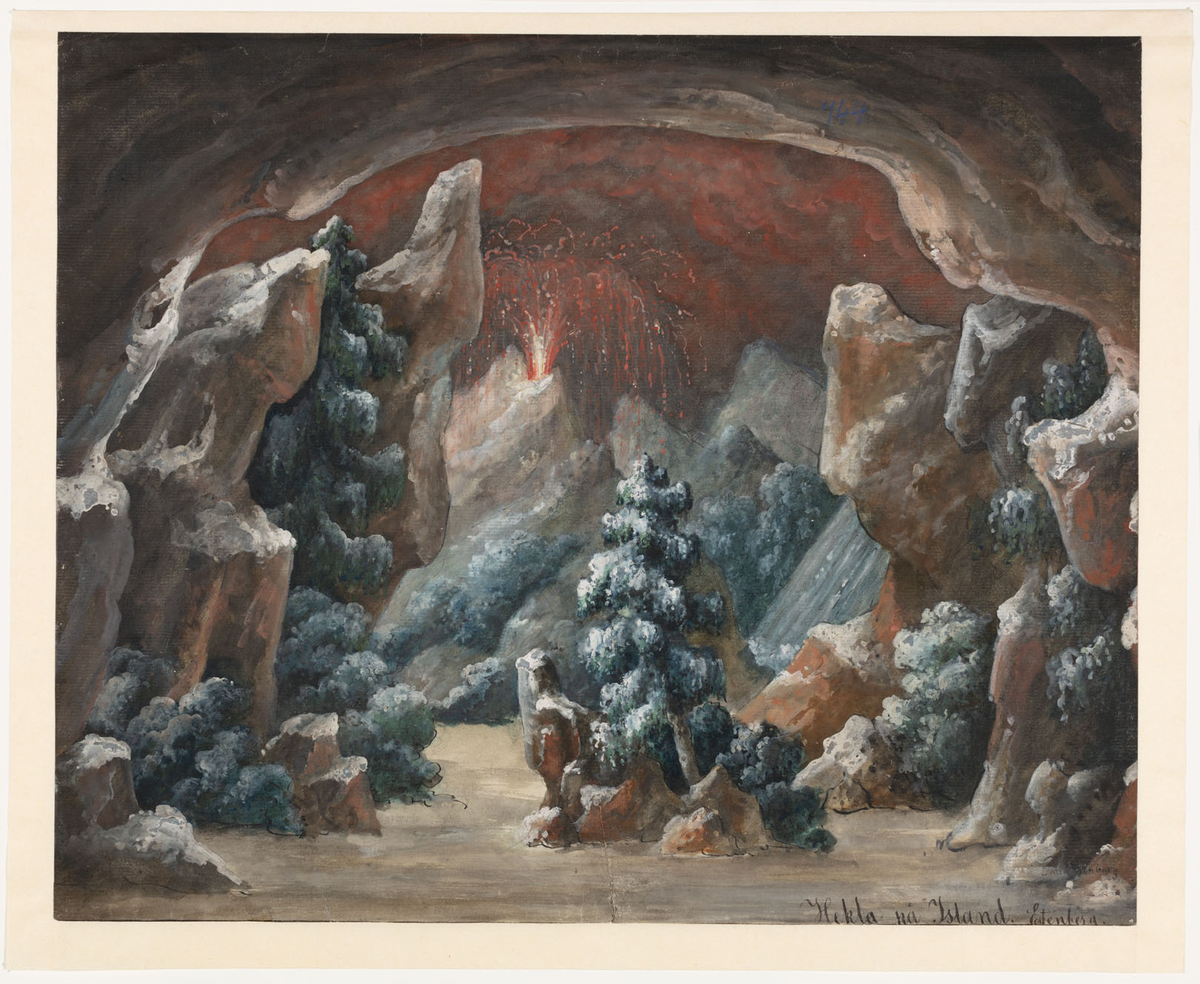 Vy inifrån grotta med stenar, buskar och träd i bakgrunden syns en vulkan med vulkanutbrott
