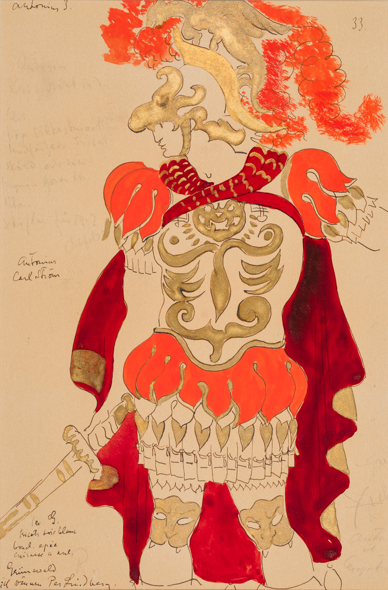 Man iklädd antikiserande rustning i ljusrött och guld, purpurröd och guldfärgad mantel och hjälm prydd av en gyllene drake och ljusröda plymer. I höger hand håller han ett svärd.
