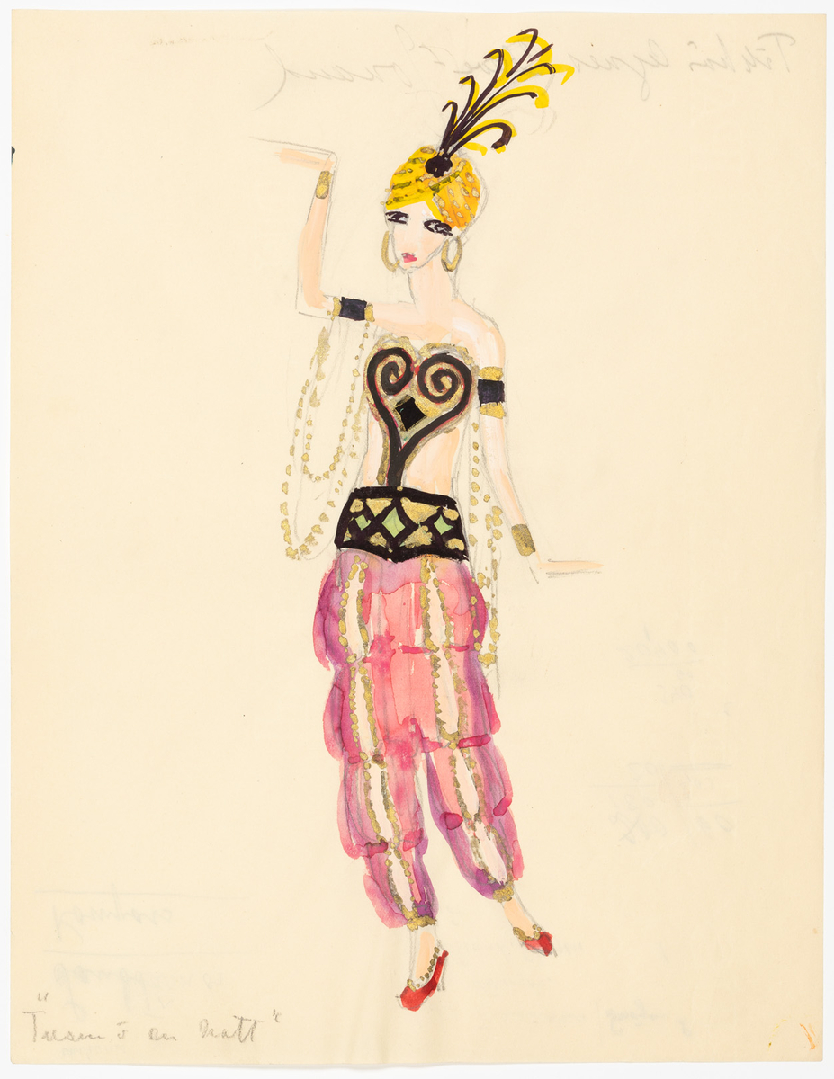 Kvinna i haremsdräkt. Livet är i guld, svart och grönt och består av en hjärtformad del som täcker bysten och ett brett bälte. Från bältet hänger vida röda byxor med guldkantade slitsar framtill. Hon bär breda guldarmband på armarna. Från armbanden på överarmarna hänger guldkedjor. På huvudet har kvinnan en gul turban med gulsvarta plymer. Skorna är i rött och guld och har höga klackar.
