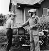 Lantbrevbärare, motorcykelåkande Holger Österberg på ön Möja
(I Stockholms skärgård) den 3/8 1956.