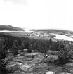 Neg nr 1. Utsikt mot Över Kalix kyrkby från Brännaberget. Foto 18.8 (1962).