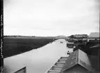 Vy över Fyrisån och järnvägsbron, Luthagen och Svartbäcken, Uppsala 1900 - 1901