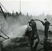 Skyddstjänst vid Bergaskolorna 1953. Eldsläckning på f.d. pasarskeppet Wasa.