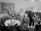 Rumsinteriör, 3 personer.
Filialchef T.E. Ljungberg.
Systerns 50 årsdag.