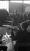 Åbyverkets invigning 12 maj 1965.

Dirigent leder orkestern under invigningen. Publik i bakgrunden.