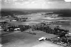 Flygfoto över Rinkaby, bostadshus och byggnader.