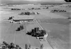 Flygfoto över Hammar, bostadshus och ekonomibyggnader.