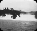 Skioptikonbild med motiv av vattenfallen Rheinfall.
Bilden har förvarats i kartong märkt: Resan 1908. Schoffhausen 7. Rheinfall  4.