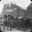 Skioptikonbild.Troligen Grindelwald i Schweiz med berget Wetterhorn i barkgrunden.