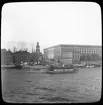 Skioptikonbild med motiv av Stockholms Slott. Taget från Skeppsholmen. Troligen vid tiden för Allmänna Konst- och Industriutställningen i Stockholm 1897.