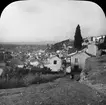 Skioptikonbild med motiv av stadsvy, Granada.
Bilden har förvarats i kartong märkt: Höstresan 1910. Granada 9. N:14. Text på bild: 