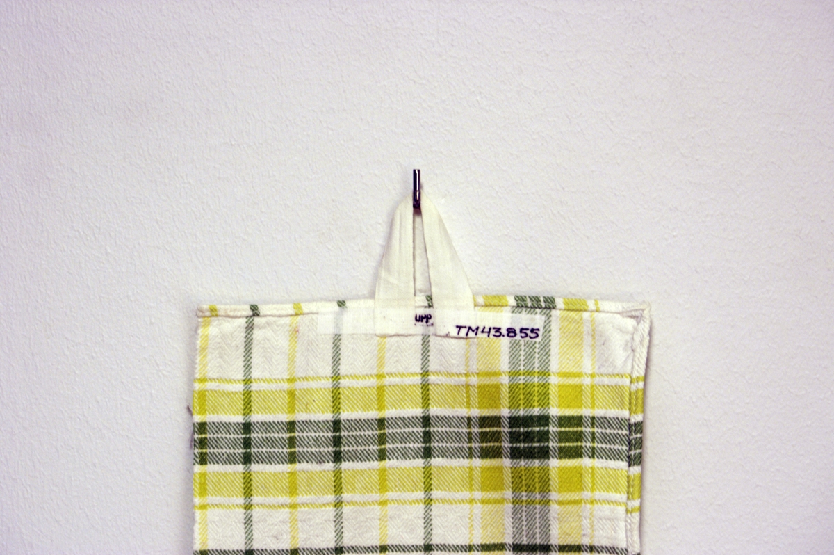 Handdukshank av bomullsband, avsedd att fästas på handduk.