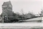 Kv. S:t Sigfrid. Westerbergsgatan-Botvidsgatan. Tomten för det nya skolbygget från Botvidsgatan. Gamla biblioteket och transformatorn.