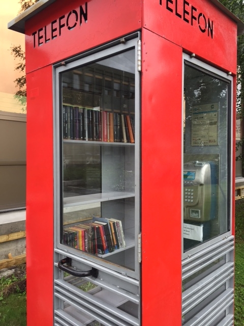 This is the story of how Norway’s most important conversation-space was designed by a young, freshly graduated man from Bergen.

“Norwegian architects are hereby invited…”
In the autumn of 1932, Oslo Telefonanlegginitiated an architectural competition. Finally, Oslo would get its own telephone booth. The city had had so called “talking-stations” from 1885, which in turn were overtaken by automatic telephones 
 only available at selected Narvesen kiosks. The state 
was of the opinion that now was the time to offer the public a better service; public telephone booths open 24/7, like the ones they already had in Sweden and England. But what would they look like, these new telephone booths? What considerations would it
 be necessary to take when designing it? The telegraph board developed a detailed list of demands and restraints: “The booth is intended to be placed outside on the streets and squares and need to be designed so that snow and ice does not hinder the opening and closing of the doors,” they wrote. “To prevent vandalism, theft, uncleanliness etc. inside the booth, it needs to be designed so that from all angles one may see what is going on in there.” Additionally, it would need to withstand storms and bad weather, and “preferably also being whipped by rain mixed with seawater” 

This was not all: The appearance would have to be «pleasing». The booth also needed to be movable, so that it could be taken in to be serviced at Telegrafverket’s main workshops. The reqired material was iron, and the surface was to be spray painted  preferably using car-body paint. There was a requirement for “a writing shelf, a pack shelf, and a suitable place for the telephone catalogue.” Also, there would need to be an illuminated TELEFON  sign, easily visible from all four angles. The total cost for each booth should not exceed 1000 kroner. The first prize for coming up with such a product was 800 kroner.

“Norwegianarchitects are hereby invited to partake in a competition for the design of a telephone booth…”  

The man with the solution
«At some point in 1932, Georg Fredrik sat at a party in Bergen. Maybe he felt a bit lost and forgotten as he often had throughout his life. He retreated to a quiet corner, took out a pencil and strted doodling on a matchbox.  According to my mother, this was how the telephone booth came into being.” In the book “Norges lille røde  historien om telefonkiosken,” Lars Fasting describes his father, the man who is far less known than the iconic architctural structure he left behind. Georg Fredrik Fasting was from Bergen, born into a family of working people and smallholders. One unusual facet of Georg Fredrik was that he was born without ears. His mother made sure he learnt to speak, read and write, 
ut Lars Fasting indicates that his father would seek refuge in drawing when the social challenges became too much to bear. And in the end drawing became his profession. In 1924 he secured a guarantor for a student loan, and started studying to become an a
rchitect at the NTH. Throughout the 1930s he entered several architectural competitions, with drafts produced, according to his son, “after work and in the late hours of the night.”

His efforts were not wasted. Out of 93 entries, with names such as “Flirt”, “Brrr”, “Ring” and “Amor”, the jury selected Fasting’s submission, “RIKS” as the new telephone booth: “The draft shows a strikingly simple solution to the task, technically as well as aesthetically well worked out.”

Taut and provident
Simple and aesthetc are the keywords here. Fasting had designed a booth pointing towards the future, and to modernism. Just how modern it was can be seen by comparing RIKS to the British telephone booth, also designed in the interwar-era. While the British version with it classicistic style is looking back to the heyday of the empire, Fasting’s booth is progressive and functionalistic. Like most Norwegian architects, Fasting broke with the classicistic style of architecture after the Stockholm-exhibition in 1930. “After it, almost all buildings erected in Norway until the German invasion in 1940, were in the functionalistic architectural style,” writes senior curator of architecture at the Norwegian National Museum, Ulf Grønvold, in the book, “Den lille røde”.“TheNorwegian booth is a piece of functionalistic architecture, an asymmetric composition with its roof slab overhanging the word TELEFON, in bold sans seraph lettering,”concludes Ulf Grønvold.

Fashionably red
And it was red. Fasting chose a colour which was part of the modern palette. “A bright red colour, but not as shiny as a signal red, the character of the colour places it among the fashionable colours within functionalism,” states paintings conservator and researcher in NIKU (Norwegian Institute for Cultural Heitage Research), Jon Brænne. In his opinion, Fasting went for visibility without making the booth stand out too much from its surroundings. The original colour was in use up to around 1950, when it changed to signal red. Towards the end of the 1970s the clour was again adjusted towards today’s orangey red.

The design, however, has not changed. RIKS is eighty years and still looks remarkably good. That’s what makes Fasting’s telephone booth a classic  even before it was added to DOCOMOMO’s list over moden icons of design. For Telenor, the telephone booth has served as a pathway into the hearts of the public. For many, Telenor (Televerket) was synonymous with exactly this telephone booth, because this was where one would go to place a call. Having a home
phone was not common until the 1980s. As such the red box became part of the Norwegian everyday and consciousness. The symbol- and publicity value of this is hard to evaluate, but in 2007 it was time to give honour where honour was due, Telenor, in consul
tation with the Directorate for Cultural Heritage, decided to preserve 100 telephone booths for all eternity.

And what about Georg Fredrik Fasting? What happened to him? At the age of 56 an entry in his diary states: «I CAN HEAR». As the first person in th world he had undergone an operation where he had ear canals constructed and eardrums fitted. For the rest of his life, the man behind Norway’s own telephone booth could answer the telephone himself.

Source: Norges lille røde historien om telefonkiosken (2007), issued by The Norwegian Telecom Museum and Telenor Cultural Heritage.
