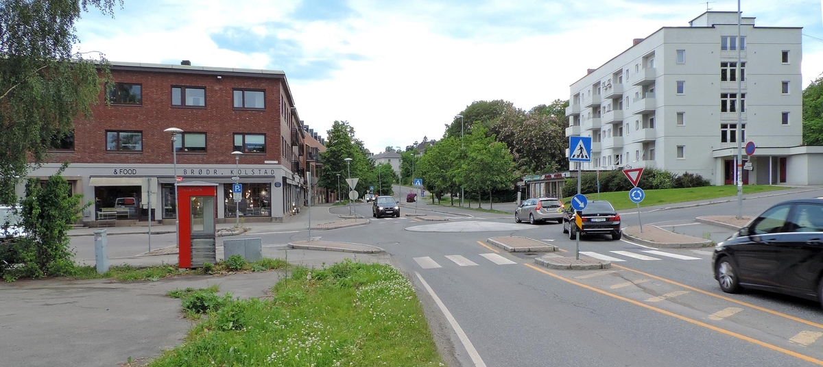 This is the story of how Norway’s most important conversation-space was designed by a young, freshly graduated man from Bergen.

“Norwegian architects are hereby invited…”
In the autumn of 1932, Oslo Telefonanlegginitiated an architectural competition. Finally, Oslo would get its own telephone booth. The city had had so called “talking-stations” from 1885, which in turn were overtaken by automatic telephones 
 only available at selected Narvesen kiosks. The state 
was of the opinion that now was the time to offer the public a better service; public telephone booths open 24/7, like the ones they already had in Sweden and England. But what would they look like, these new telephone booths? What considerations would it
 be necessary to take when designing it? The telegraph board developed a detailed list of demands and restraints: “The booth is intended to be placed outside on the streets and squares and need to be designed so that snow and ice does not hinder the opening and closing of the doors,” they wrote. “To prevent vandalism, theft, uncleanliness etc. inside the booth, it needs to be designed so that from all angles one may see what is going on in there.” Additionally, it would need to withstand storms and bad weather, and “preferably also being whipped by rain mixed with seawater” 

This was not all: The appearance would have to be «pleasing». The booth also needed to be movable, so that it could be taken in to be serviced at Telegrafverket’s main workshops. The reqired material was iron, and the surface was to be spray painted  preferably using car-body paint. There was a requirement for “a writing shelf, a pack shelf, and a suitable place for the telephone catalogue.” Also, there would need to be an illuminated TELEFON  sign, easily visible from all four angles. The total cost for each booth should not exceed 1000 kroner. The first prize for coming up with such a product was 800 kroner.

“Norwegianarchitects are hereby invited to partake in a competition for the design of a telephone booth…”  

The man with the solution
«At some point in 1932, Georg Fredrik sat at a party in Bergen. Maybe he felt a bit lost and forgotten as he often had throughout his life. He retreated to a quiet corner, took out a pencil and strted doodling on a matchbox.  According to my mother, this was how the telephone booth came into being.” In the book “Norges lille røde  historien om telefonkiosken,” Lars Fasting describes his father, the man who is far less known than the iconic architctural structure he left behind. Georg Fredrik Fasting was from Bergen, born into a family of working people and smallholders. One unusual facet of Georg Fredrik was that he was born without ears. His mother made sure he learnt to speak, read and write, 
ut Lars Fasting indicates that his father would seek refuge in drawing when the social challenges became too much to bear. And in the end drawing became his profession. In 1924 he secured a guarantor for a student loan, and started studying to become an a
rchitect at the NTH. Throughout the 1930s he entered several architectural competitions, with drafts produced, according to his son, “after work and in the late hours of the night.”

His efforts were not wasted. Out of 93 entries, with names such as “Flirt”, “Brrr”, “Ring” and “Amor”, the jury selected Fasting’s submission, “RIKS” as the new telephone booth: “The draft shows a strikingly simple solution to the task, technically as well as aesthetically well worked out.”

Taut and provident
Simple and aesthetc are the keywords here. Fasting had designed a booth pointing towards the future, and to modernism. Just how modern it was can be seen by comparing RIKS to the British telephone booth, also designed in the interwar-era. While the British version with it classicistic style is looking back to the heyday of the empire, Fasting’s booth is progressive and functionalistic. Like most Norwegian architects, Fasting broke with the classicistic style of architecture after the Stockholm-exhibition in 1930. “After it, almost all buildings erected in Norway until the German invasion in 1940, were in the functionalistic architectural style,” writes senior curator of architecture at the Norwegian National Museum, Ulf Grønvold, in the book, “Den lille røde”.“TheNorwegian booth is a piece of functionalistic architecture, an asymmetric composition with its roof slab overhanging the word TELEFON, in bold sans seraph lettering,”concludes Ulf Grønvold.

Fashionably red
And it was red. Fasting chose a colour which was part of the modern palette. “A bright red colour, but not as shiny as a signal red, the character of the colour places it among the fashionable colours within functionalism,” states paintings conservator and researcher in NIKU (Norwegian Institute for Cultural Heitage Research), Jon Brænne. In his opinion, Fasting went for visibility without making the booth stand out too much from its surroundings. The original colour was in use up to around 1950, when it changed to signal red. Towards the end of the 1970s the clour was again adjusted towards today’s orangey red.

The design, however, has not changed. RIKS is eighty years and still looks remarkably good. That’s what makes Fasting’s telephone booth a classic  even before it was added to DOCOMOMO’s list over moden icons of design. For Telenor, the telephone booth has served as a pathway into the hearts of the public. For many, Telenor (Televerket) was synonymous with exactly this telephone booth, because this was where one would go to place a call. Having a home
phone was not common until the 1980s. As such the red box became part of the Norwegian everyday and consciousness. The symbol- and publicity value of this is hard to evaluate, but in 2007 it was time to give honour where honour was due, Telenor, in consul
tation with the Directorate for Cultural Heritage, decided to preserve 100 telephone booths for all eternity.

And what about Georg Fredrik Fasting? What happened to him? At the age of 56 an entry in his diary states: «I CAN HEAR». As the first person in th world he had undergone an operation where he had ear canals constructed and eardrums fitted. For the rest of his life, the man behind Norway’s own telephone booth could answer the telephone himself.

Source: Norges lille røde historien om telefonkiosken (2007), issued by The Norwegian Telecom Museum and Telenor Cultural Heritage.
