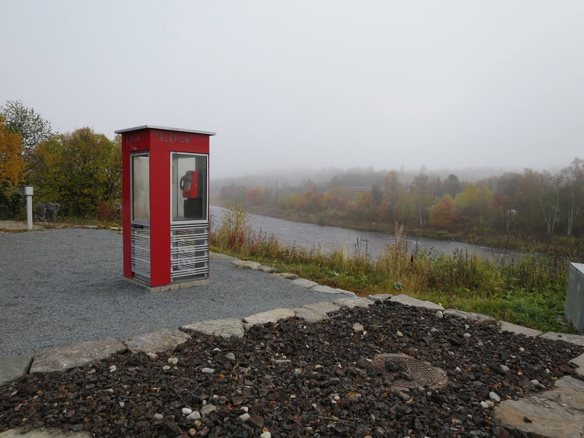 This is the story of how Norway’s most important conversation-space was designed by a young, freshly graduated man from Bergen.

“Norwegian architects are hereby invited…”
In the autumn of 1932, Oslo Telefonanlegginitiated an architectural competition. Finally, Oslo would get its own telephone booth. The city had had so called “talking-stations” from 1885, which in turn were overtaken by automatic telephones 
 only available at selected Narvesen kiosks. The state 
was of the opinion that now was the time to offer the public a better service; public telephone booths open 24/7, like the ones they already had in Sweden and England. But what would they look like, these new telephone booths? What considerations would it
 be necessary to take when designing it? The telegraph board developed a detailed list of demands and restraints: “The booth is intended to be placed outside on the streets and squares and need to be designed so that snow and ice does not hinder the opening and closing of the doors,” they wrote. “To prevent vandalism, theft, uncleanliness etc. inside the booth, it needs to be designed so that from all angles one may see what is going on in there.” Additionally, it would need to withstand storms and bad weather, and “preferably also being whipped by rain mixed with seawater” 

This was not all: The appearance would have to be «pleasing». The booth also needed to be movable, so that it could be taken in to be serviced at Telegrafverket’s main workshops. The reqired material was iron, and the surface was to be spray painted  preferably using car-body paint. There was a requirement for “a writing shelf, a pack shelf, and a suitable place for the telephone catalogue.” Also, there would need to be an illuminated TELEFON  sign, easily visible from all four angles. The total cost for each booth should not exceed 1000 kroner. The first prize for coming up with such a product was 800 kroner.

“Norwegianarchitects are hereby invited to partake in a competition for the design of a telephone booth…”  

The man with the solution
«At some point in 1932, Georg Fredrik sat at a party in Bergen. Maybe he felt a bit lost and forgotten as he often had throughout his life. He retreated to a quiet corner, took out a pencil and strted doodling on a matchbox.  According to my mother, this was how the telephone booth came into being.” In the book “Norges lille røde  historien om telefonkiosken,” Lars Fasting describes his father, the man who is far less known than the iconic architctural structure he left behind. Georg Fredrik Fasting was from Bergen, born into a family of working people and smallholders. One unusual facet of Georg Fredrik was that he was born without ears. His mother made sure he learnt to speak, read and write, 
ut Lars Fasting indicates that his father would seek refuge in drawing when the social challenges became too much to bear. And in the end drawing became his profession. In 1924 he secured a guarantor for a student loan, and started studying to become an a
rchitect at the NTH. Throughout the 1930s he entered several architectural competitions, with drafts produced, according to his son, “after work and in the late hours of the night.”

His efforts were not wasted. Out of 93 entries, with names such as “Flirt”, “Brrr”, “Ring” and “Amor”, the jury selected Fasting’s submission, “RIKS” as the new telephone booth: “The draft shows a strikingly simple solution to the task, technically as well as aesthetically well worked out.”

Taut and provident
Simple and aesthetc are the keywords here. Fasting had designed a booth pointing towards the future, and to modernism. Just how modern it was can be seen by comparing RIKS to the British telephone booth, also designed in the interwar-era. While the British version with it classicistic style is looking back to the heyday of the empire, Fasting’s booth is progressive and functionalistic. Like most Norwegian architects, Fasting broke with the classicistic style of architecture after the Stockholm-exhibition in 1930. “After it, almost all buildings erected in Norway until the German invasion in 1940, were in the functionalistic architectural style,” writes senior curator of architecture at the Norwegian National Museum, Ulf Grønvold, in the book, “Den lille røde”.“TheNorwegian booth is a piece of functionalistic architecture, an asymmetric composition with its roof slab overhanging the word TELEFON, in bold sans seraph lettering,”concludes Ulf Grønvold.

Fashionably red
And it was red. Fasting chose a colour which was part of the modern palette. “A bright red colour, but not as shiny as a signal red, the character of the colour places it among the fashionable colours within functionalism,” states paintings conservator and researcher in NIKU (Norwegian Institute for Cultural Heitage Research), Jon Brænne. In his opinion, Fasting went for visibility without making the booth stand out too much from its surroundings. The original colour was in use up to around 1950, when it changed to signal red. Towards the end of the 1970s the clour was again adjusted towards today’s orangey red.

The design, however, has not changed. RIKS is eighty years and still looks remarkably good. That’s what makes Fasting’s telephone booth a classic  even before it was added to DOCOMOMO’s list over moden icons of design. For Telenor, the telephone booth has served as a pathway into the hearts of the public. For many, Telenor (Televerket) was synonymous with exactly this telephone booth, because this was where one would go to place a call. Having a home
phone was not common until the 1980s. As such the red box became part of the Norwegian everyday and consciousness. The symbol- and publicity value of this is hard to evaluate, but in 2007 it was time to give honour where honour was due, Telenor, in consul
tation with the Directorate for Cultural Heritage, decided to preserve 100 telephone booths for all eternity.

And what about Georg Fredrik Fasting? What happened to him? At the age of 56 an entry in his diary states: «I CAN HEAR». As the first person in th world he had undergone an operation where he had ear canals constructed and eardrums fitted. For the rest of his life, the man behind Norway’s own telephone booth could answer the telephone himself.

Source: Norges lille røde historien om telefonkiosken (2007), issued by The Norwegian Telecom Museum and Telenor Cultural Heritage.