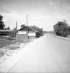 Motortjänst AB. Foto av skyltar. Hemlingby. Juli 1939