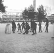 Skridskoåkning och hockespel på Kristinaplan i Gävle, 1957.