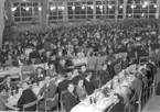 Konsum Alfa 50-årsjubileum på Rotundan, Folkparken. Medaljutdelning och middagsbord. 25 november 1948.