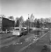 Vårreportage. Bil på Drottningbron, översvämning den 3 mars 1950