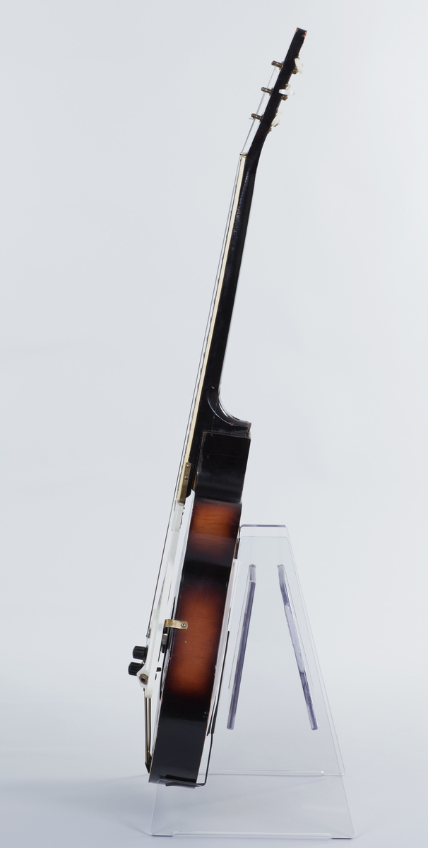 Gitar med enkel cutaway og hul kropp (hollow body), lakkert i Sunburst-finish. Påmontert kombinert pickup og plekterbrett med kontrollere for volum og tone.