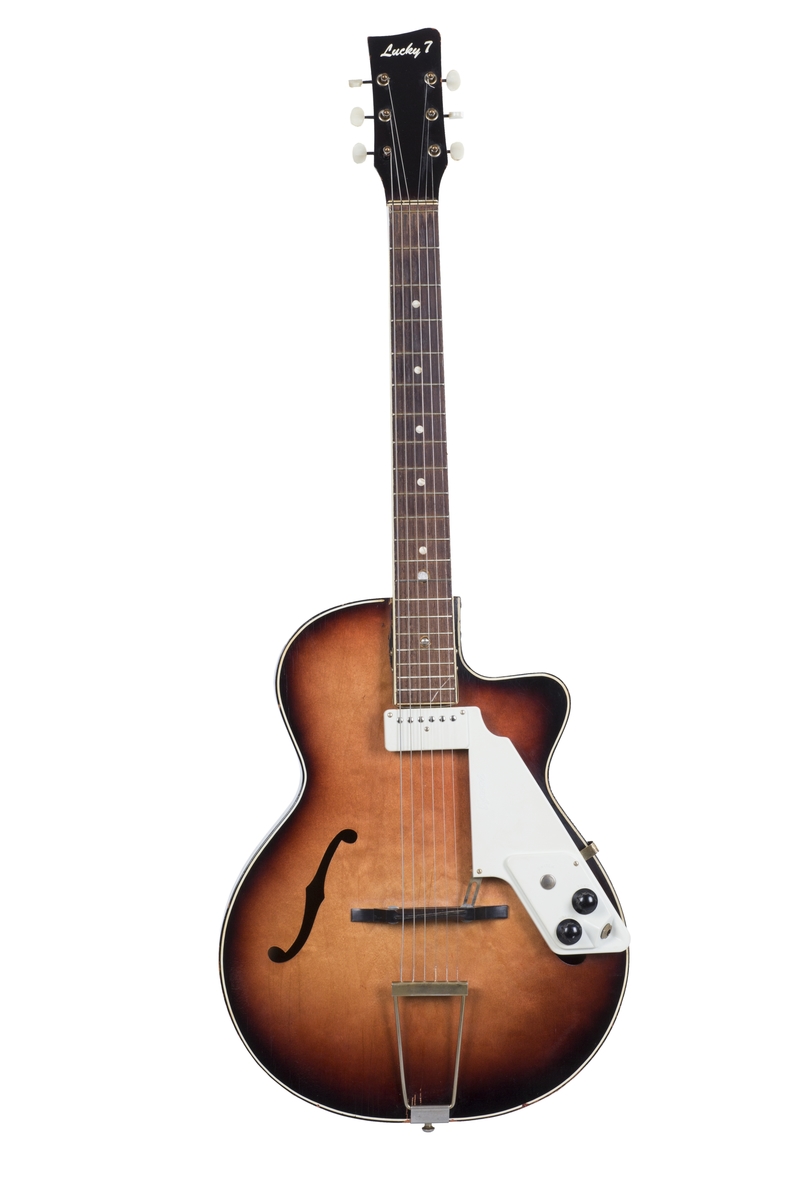 Gitar med enkel cutaway og hul kropp (hollow body), lakkert i Sunburst-finish. Påmontert kombinert pickup og plekterbrett med kontrollere for volum og tone.
