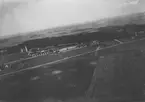 Flygfotografi av Flygkompaniets verkstäder på Malmen, 1923.