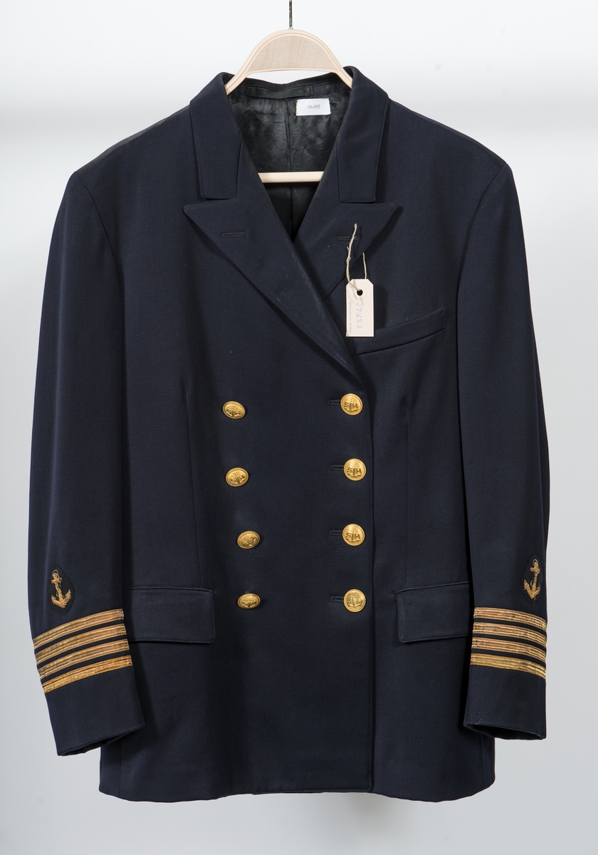 Uniformskavaj för hamnkapten vid Stockholms hamn. Gradbeteckning: 4 st 11 mm breda guldgaloner, däröver ett guldstickat ankare. Knapp: gul metallknapp med ankare, läggen krönt av tre kronor på spira och flankerat av bokstäverna S och H. Dubbelknäppt med fyra knapper per rad.