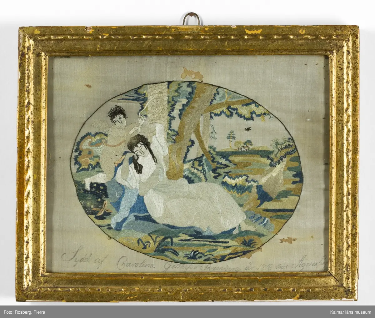 Landskap med figurscen, Amor och Psyke. En halvliggande Psyke med den bevingade Amor till vänster i motivet.