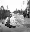 Reportage för Gefle Posten. Översvämningar. Ev i Hamrångetrakten. År 1937