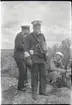 Högste befälhavaren över Kustflottan amiral Åkermark och 2 flaggadjutant kapten Wachtmeister med gasmask,
landstigningsövningen på Stabbo 1929