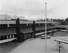 Dokumentation av Barnängen.
Barnängens fabrik köpt av Grummebolagen, inflyttning 1983.
Bakom fabriken i övre högra delen av bilden syns Ekerö centrum.