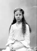 Greta Bäckström är syster till Karin Bäckström.

Karin Bäckström f. 1880 drev fotoateljé på Vasagatan 5 i Töreboda. Hon tog över den av sin far Thure Bäckström, som hade etablerat firman 1886, och hon drev den mellan 1896 -1916.
Karin Bäckström gifte sig år 1917 med John Knape.