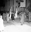 Skara. Lottakårens 25-årsjubileum 1954. Högtidlighet i Skara Domkyrka.