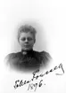 Tekla Forssell år 1896.
Postexpeditör.
Postexpeditör Tekla Erika Charlotta Forssell. Född 1862 i Skara, död 1940 i Skara.
Dotter till Nils Edvard Forssell och Maria Forssell (f. Torin). 
Syster till Karl Bror Jacob Forssell och Emma Walter (f. Forssell).

Ida Hammar drev fotoateljé på Skolgatan 13 & 14 i Skara. Firman etablerades 1895. Filial i Axvall och Nossebro.