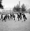 Skridskoåkning och hockespel på Kristinaplan i Gävle, 1957.