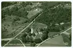 Håbol. Flygfoto över Håbols kyrka