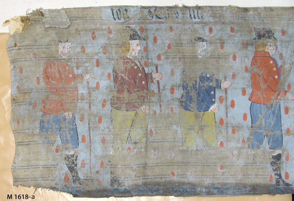 Bonadsmålning av Sven Nilsson, 1833 (Eva Kjerström-Sjölin, 1971:82) med religiösa motiv. Målad med tempera - pigment, ägg och ev. mjöl (Nyström 2012:150-151) - på tuskaftvävt linnetyg med blå varpränder. Har troligen suttit ihop med M 10615-a med de gemensamma motiven enligt registerkortet - Jesu inridande i Jerusalem, Christi frestelse av djävulen, änkans son i Nain, Jesu bergspredikan, "Soli Deo gloria" samt försedd med inskrift.

Inskrivet i huvudkatalogen 1892-1900.