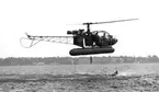 Räddningsövning med helikopter på Bottensjön 1962. Albumet är en del av en donation från Karl-Axel Hansson, Karlsborg. Förteckning över hela donationen finns som World-dokument.