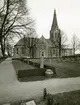 Vy av S:t Johannes kyrka med kyrkogården i förgrunden, Norrköping 1970