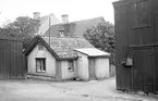 Dokumentation av Hunnebergsgatan 23 i Linköping. Året är 1929. Bilden visar ett av gårdshusen. Vy från väster.