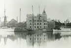 Exteriör. Huvudkontoret under uppförande 1898, Gustavsbergs Hamn och Farstaviken.