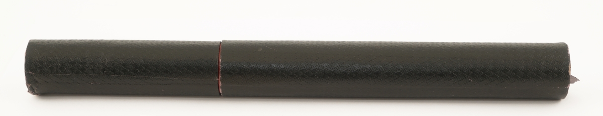 Termometer av glass  som ligger i et rundt etui av formentlig papp.