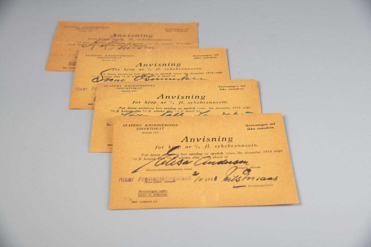 Rektangulær papirsedel, gulnet papir. Sort, trykket tekst. Anvisningene er utstedt av Statens Rationeringsdirektorat og er gitt skjemanummer 123. Pasienten hadde anledning til å velge mellom en halv flaske konjakk, whisky eller akevitt.

Brennevinsforbudet, som i Norge varte fra  1916 til 1927, startet som et midlertidig forbud i forbindelse med jule- og nyttårshøytiden. Etter en henvendelse fra politimestrene i landets tre største byer på nyåret 1917 og en folkeavstemning i 1919, ble imidlertid forbudet først forlenget og så lovfestet. (Kilde: IKA Trønderlag)

A. Dato: 21/4 - 1918.
B. Dato: 21/11 (usikker) 1918.
C. Dato. 21/11 1918.
D. Dato: 16/11 1918.