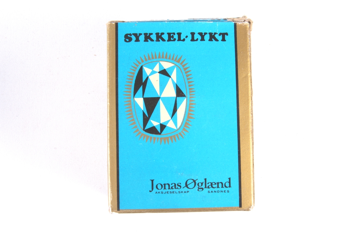 To originalemballasje til sykkellykt. Det er kun den ene som inneholder sykkellykt.