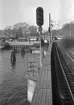 Ljussignl INFSI, infartssignal, vid Stockholm Central. På bilden finns även en så kallad dvärgsignal. Denna typ av signal började SJ använda 1923. Spårvagn SS A1. Stockholms Spårvägar bildades 1916.