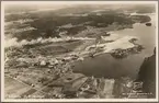 Flygfoto över Åmmeberg industrier med omgivningar.