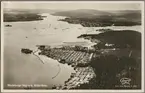 Flygfoto över sågverket i Marieberg vid Ångermanälven, taget söderifrån.